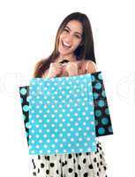 Excited young shopaholic woman posing