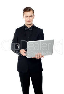 Casual young man with laptop