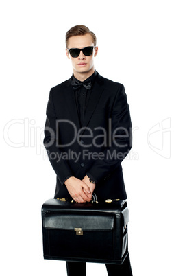 Young man carrying briefcase