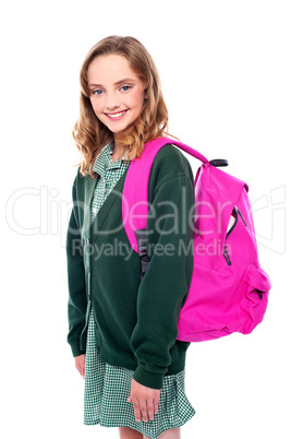 School girl carrying bag on shoulders