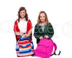 Pretty girls unzipping school bag