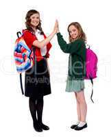 Students giving high five to each other
