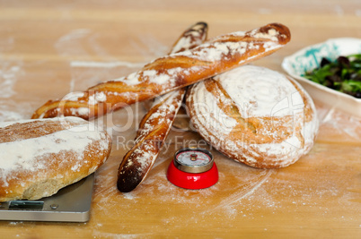Baguettes and breads on wooden table