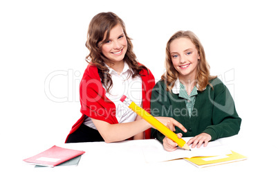 Teenagers studying together and having fun