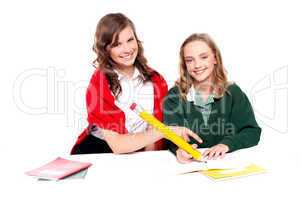 Teenagers studying together and having fun