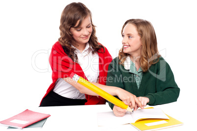 Girl explaining solution to her friend