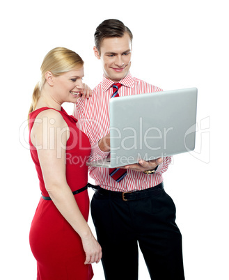 Office workers holding a laptop