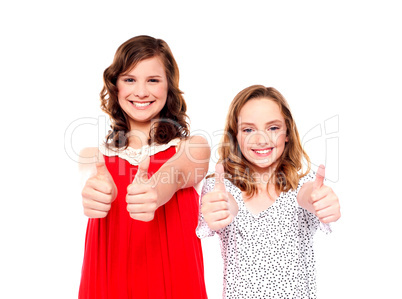 Two friends gesturing thumbs up
