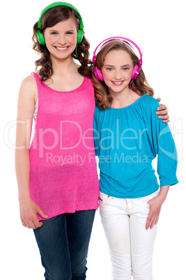 Girls standing together and enjoying music