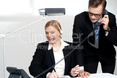 Male executive attending clients call