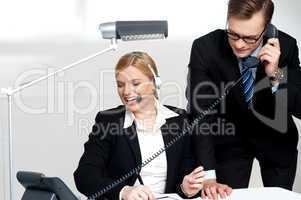 Male executive attending clients call