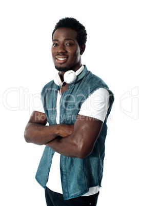 Man standing with headphones around his neck