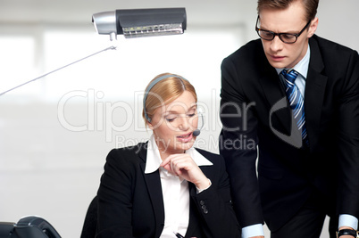 Female secretary explaining to boss