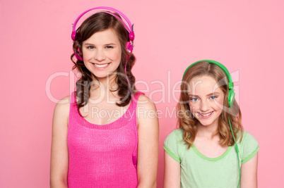 Smiling girls posing with headphone