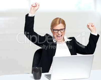 Caucasian corporate woman enjoying success