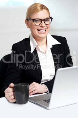 Attractive female holding black coffee cup