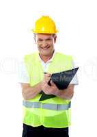 Smiling senior construction engineer