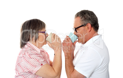 Aged love couple drinking coffee