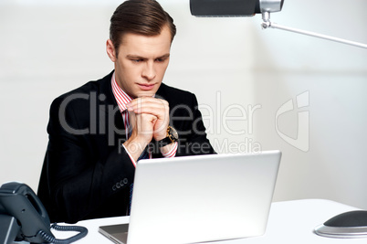 Serious businessman concentrating