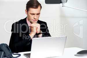 Serious businessman concentrating