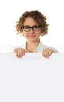 Aged woman behind big blank white banner ad