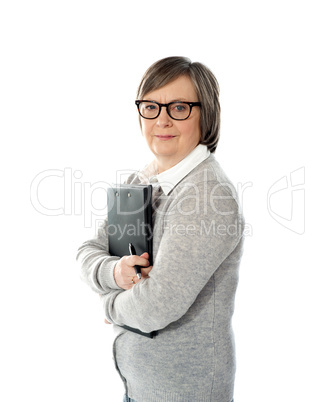 Aged woman holding business documents