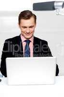 Business male watching videos on laptop