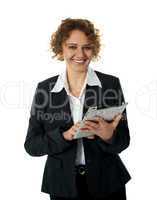 Aged businesswoman using touch screen device