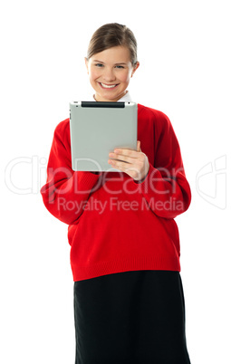 Confident girl using wireless portable device