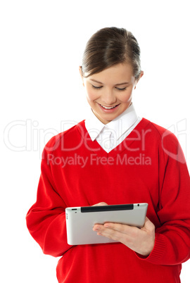 Happy young girl using tablet pc