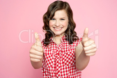 Gorgeous girl showing double thumbs up