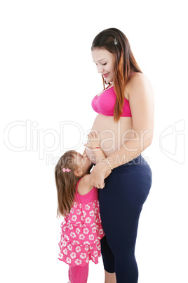 Nice Caucasian woman pregnant with her daughter on the backgroun