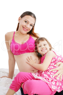 Beautiful pregnant woman with her daughter