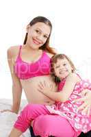 Beautiful pregnant woman with her daughter
