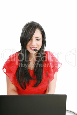 Young Woman with a headset and computer at Hotline.