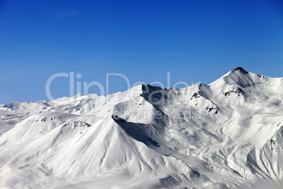 Winter mountains and blue sky