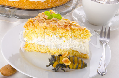 flat cake with an almond and sugar coating and a custard or cream filling