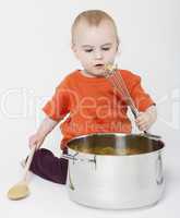 baby with big cooking pot