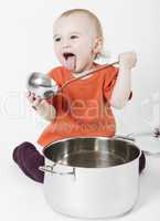 baby with big cooking pot