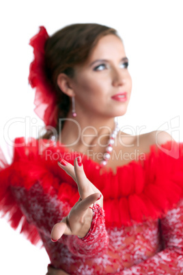 Pretty woman in red dress performing flamenco