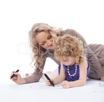 Happy mother and daughter draw