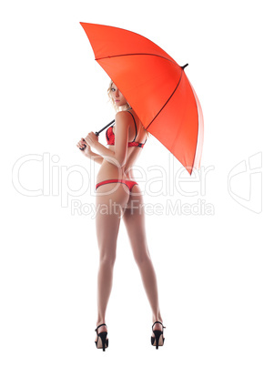 Sexy young woman posing with umbrella