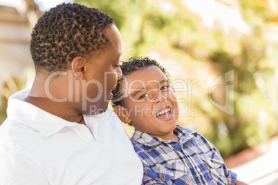 Happy Mixed Race Father and Son Talking