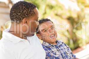 Happy Mixed Race Father and Son Talking