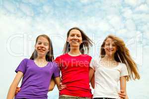 Three teen cheerful girls