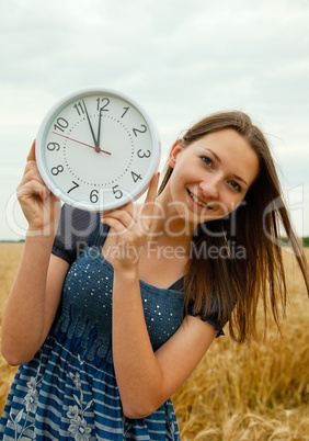 Teen girl holds watches