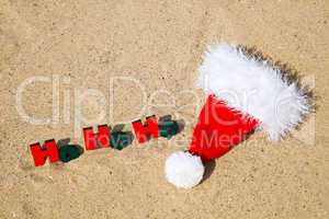 Wooden word 'Ho! Ho! Ho!' with Santa's hat