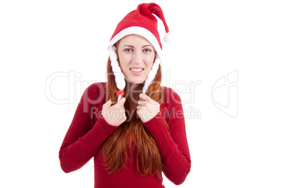 Lachende Junge Frau zur Weihnachtszeit mit roter Nikolausmütze