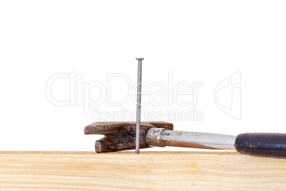 Hammer and nail with wooden board