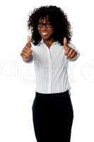 Corporate woman gesturing double thumbs up